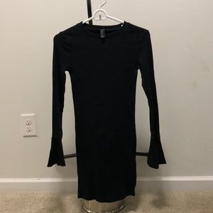 Black dress fitted with bell sleeve
